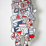 Graffiti-like form with legs in white, blue, and red.
