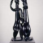 Bronze sculpture of two abstracted women figures. 
