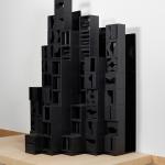 Black, stacked wooden box shapes